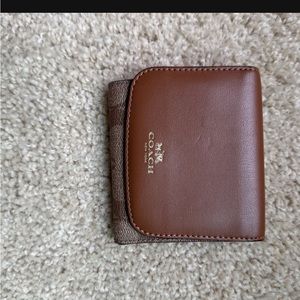 Very lightly used leather monogramed coach wallet